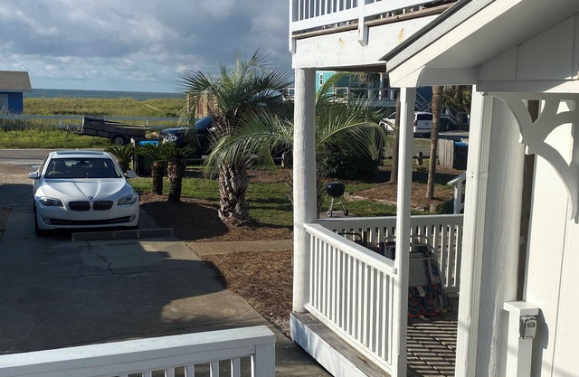 Adorable Beach Cottage. Full size swimming pool shared by four units in building