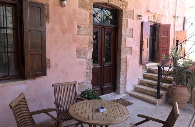 An ambient 19th century semi-basement studio only steps from the Cretan Sea