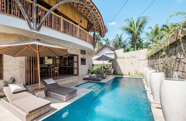 An eco-friendly villa with a tropical ambiance for relaxation and tranquility.