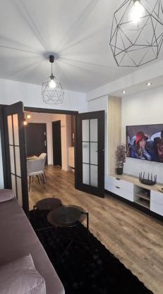 Apartament Burgund 2 pokojowy z ogródkiem lub pokoje ze wspólną kuchnią i łazienką