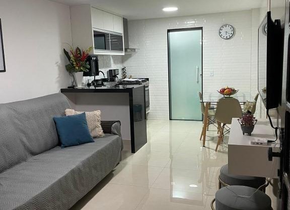 Apartamento moderno e super confortável localizado a alguns passos da Praia Grande