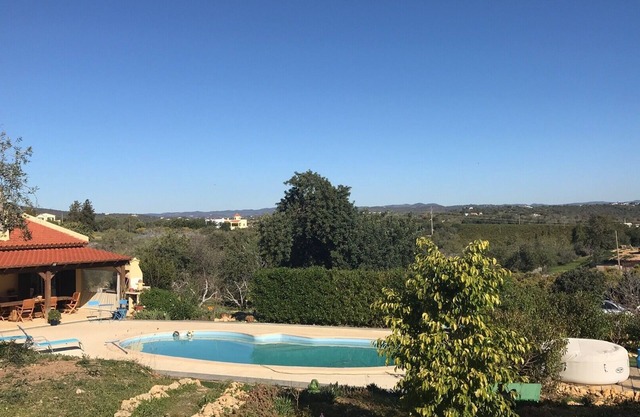 Apartment or studio amid orange and olive trees