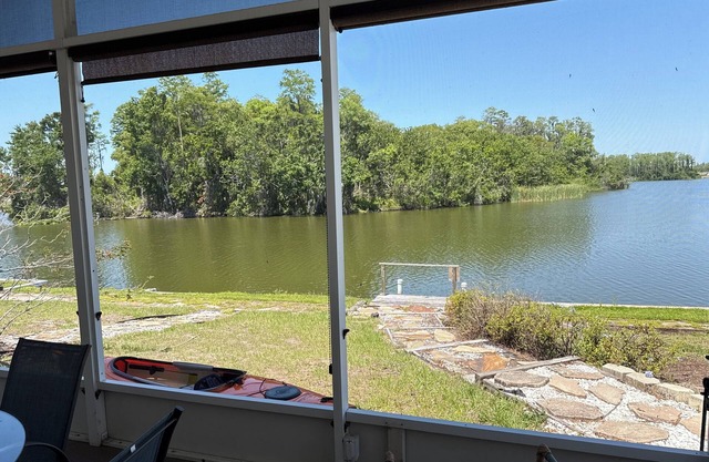Beautiful lake front house with gorgeous nature views. Situated on a corner lot.