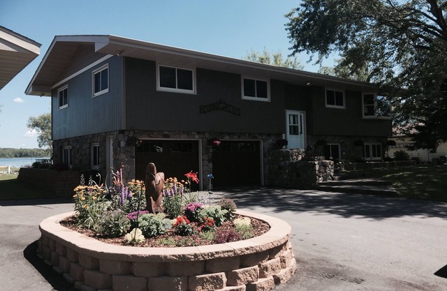 .Beautiful, spacious lake home with level elevation to sandy beach.
