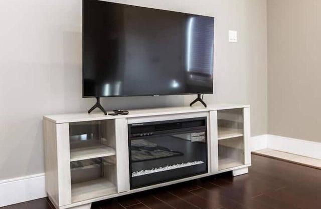 Beautiful walkout basement suite with floor to ceiling windows and a great view