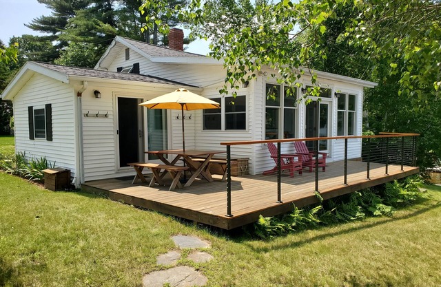 Beautifully landscaped home on Panther Pond just 20 feet from the shore!