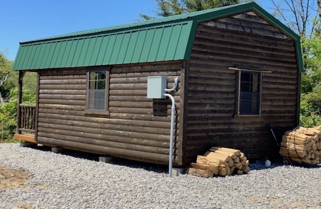 Big Mike's Cabin on the lake, next to ball diamonds nestled in 3 -cabin village