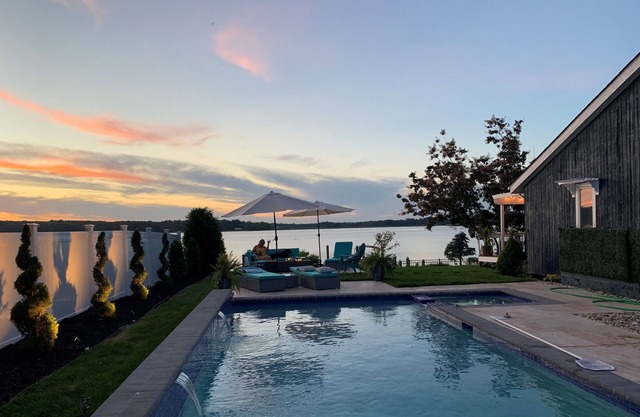Breathtaking waterfront property with pool, private dock and open floor plan.
