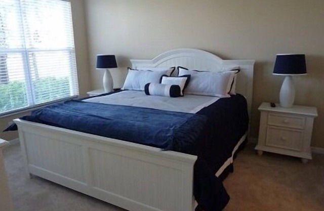 Brightly Furnished 2BR 2BA + Den End Unit Carriage House on Water