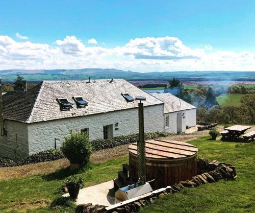 Buzzard Cottage nestled in a hillside farm