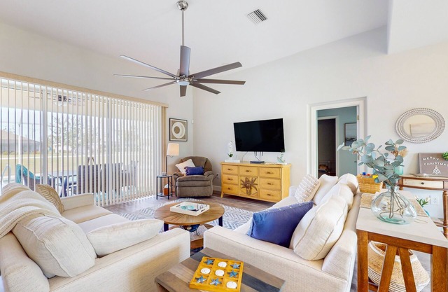 Canal-front home with private heated pool, patio, canal views & bikes