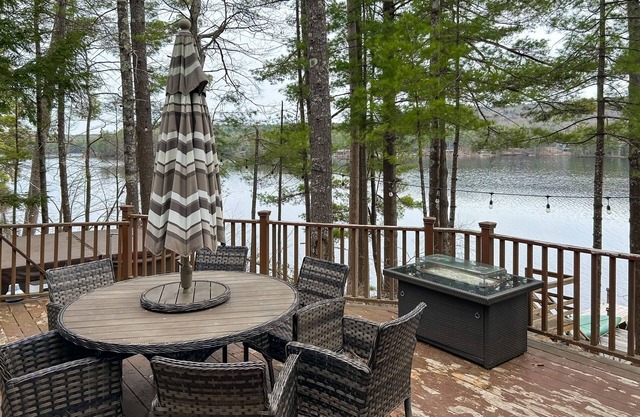 Central lakefront house with private hot tub, dock, patio bar, & beach access