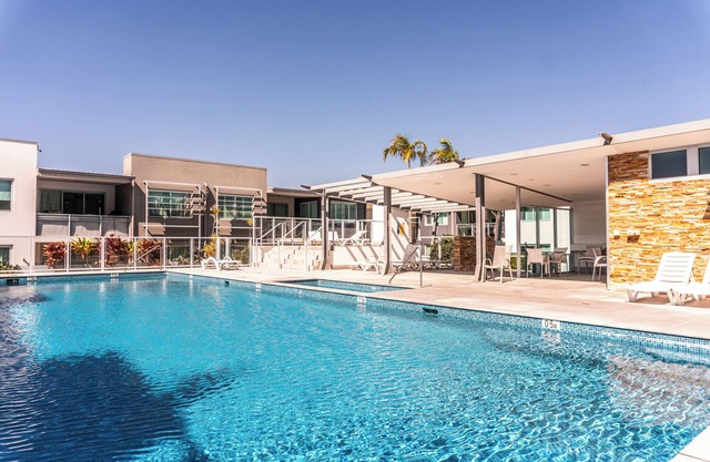 Central Palm Beach location, secure residence, onsite parking, unbeatable coastal lifestyle.