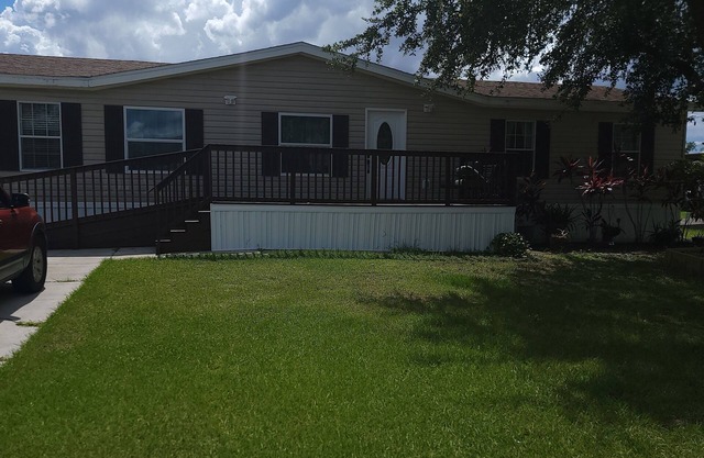 Charming 4-bedroom house with coffee/tea station WiFi and AC in Kissimmee