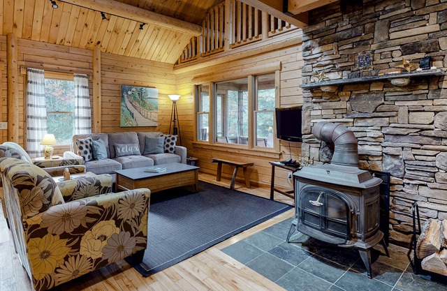 Charming, Lakefront Cabin with a Fireplace, Wood Stove, Kayaks, & Sandy Beach