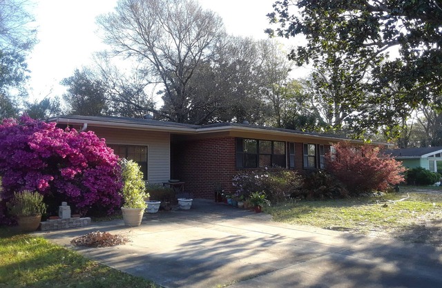 Charming ranch style home with a private patio in quiet neighborhood.