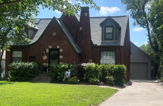 Charming Tudor Retreat in Perfect Location with Fenced Yard and Garage