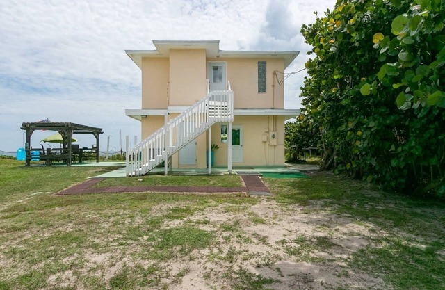 Charming Two Story House located directly on Melbourne Beach.