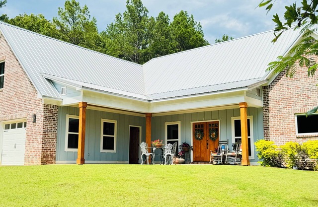 Chef designed kitchen, 3 living spaces, surrounded by woods for privacy!