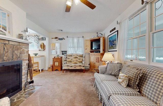 Coastal dog-friendly cottage near Hen Cove with sunroom, beach access, & games