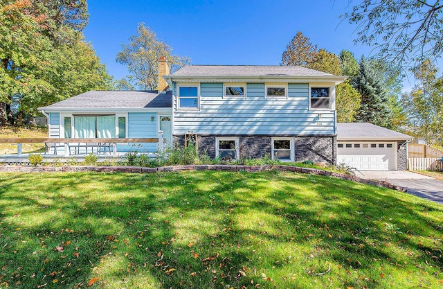 Comfortable home in a great location with enclosed yard, family room, & kayaks