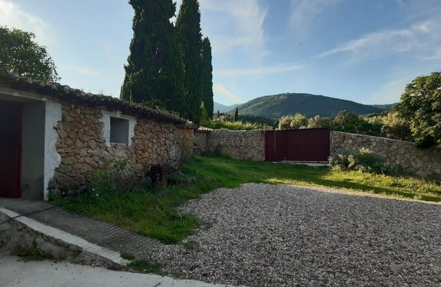 Cottage. With stables and horses