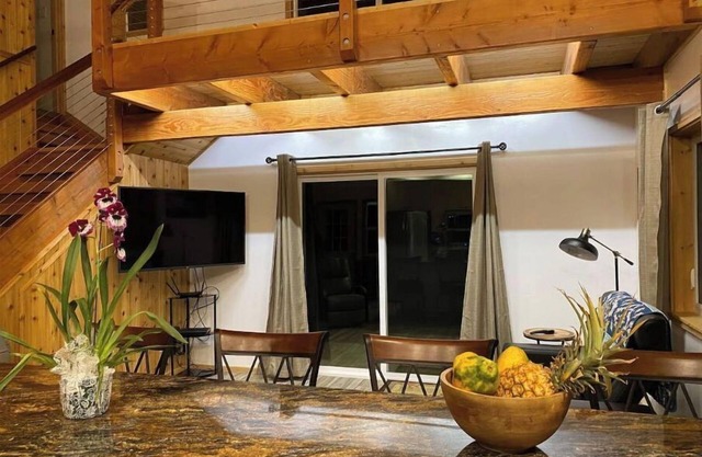 Custom cottage feels bright & airy yet cozy and private in this country setting.