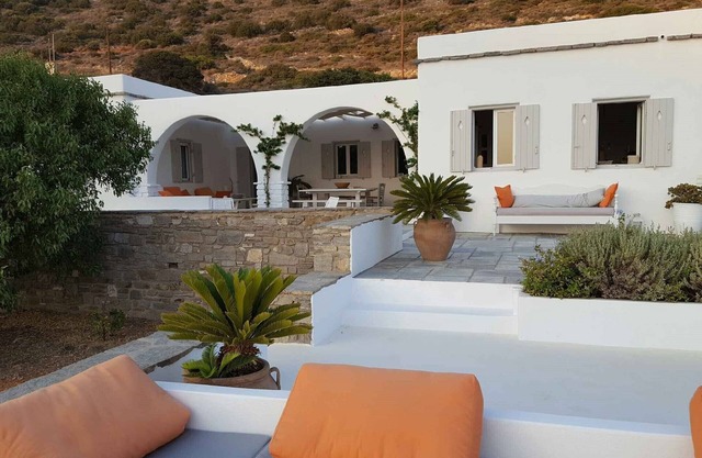 Cycladic house between olive trees and Aegean sea, magnificent sea view