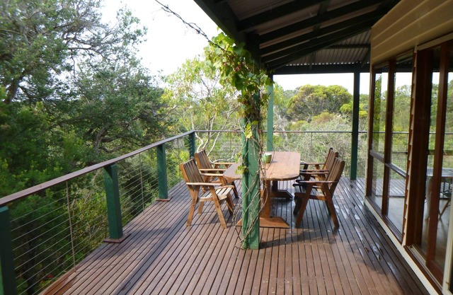 Decks with views, fireplace and playground. all only a short walk to beach.