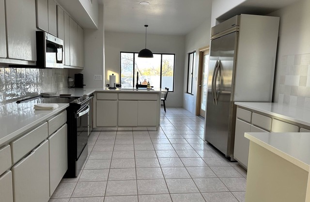 Desert oasis in the heart of the Tucson Mountains nestled by iconic Saguaros.