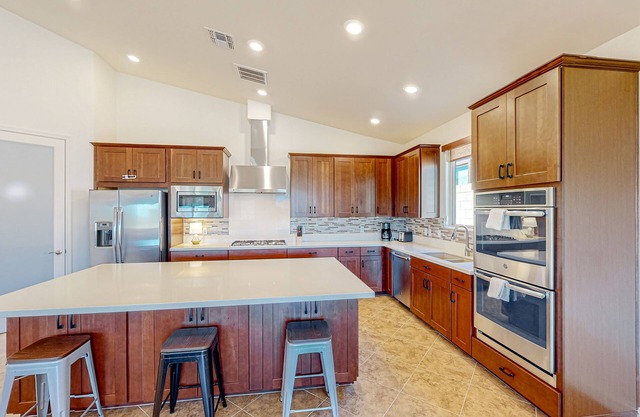 Dog-friendly home with a patio, putting green, & games - pool and gym access