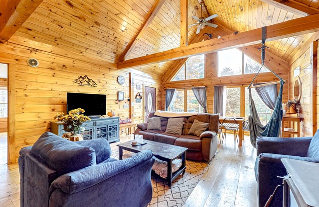 Dog-friendly log cabin on 44 acres with woodstove & porch, near lakes/skiing