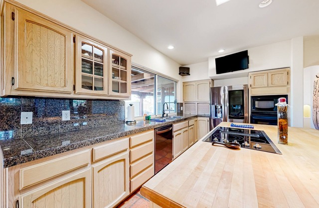 Dog-friendly oasis home with a private pool, pool spa, putting green, & W/D
