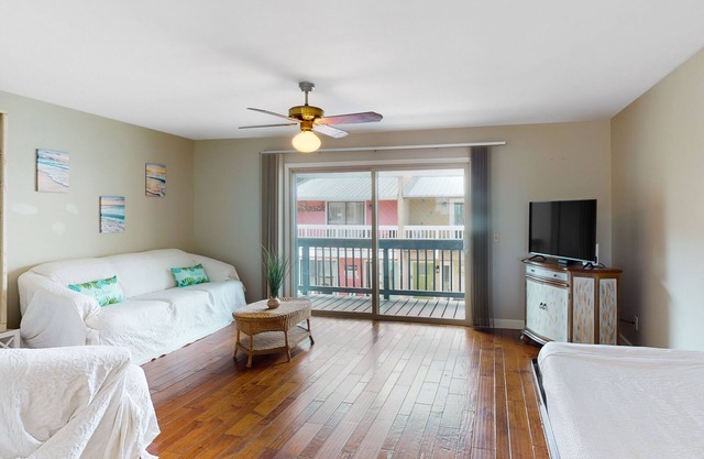 Dog-friendly condo with pool, balcony, beach access, central AC, & W/D