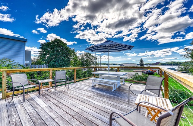 Elegant home right in town with gorgeous water view, deck & interior