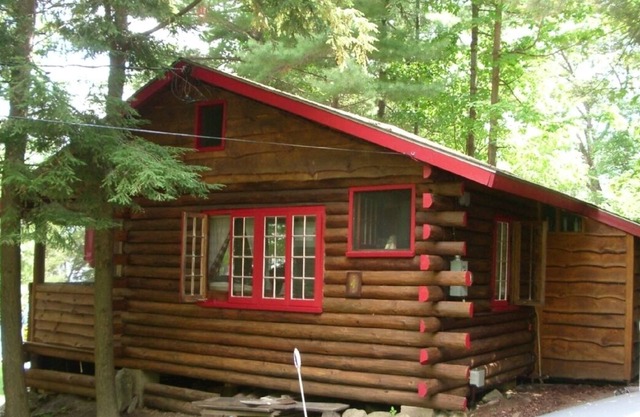 Enjoy a charming 1939 Log Cabin on gorgeous Lake George .