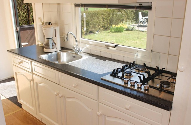 Enjoy a pleasant vacation in Friesland in this practically furnished chalet in Tzummarum.