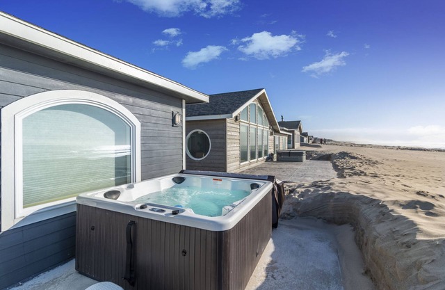 Enjoy surf or sunset in the Hot Tub at this Beachfront Home in a Gated Community