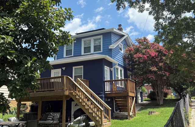 Entire two kitchen home including basement studio w/parking, deck, and yard.