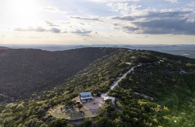 Escape to your private sanctuary nestled atop a serene hill with amazing views.