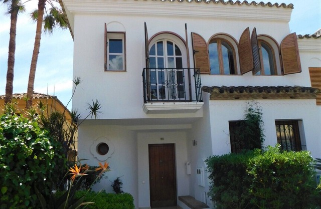 Exceptional modern village house overlooking pool with views of sea.
