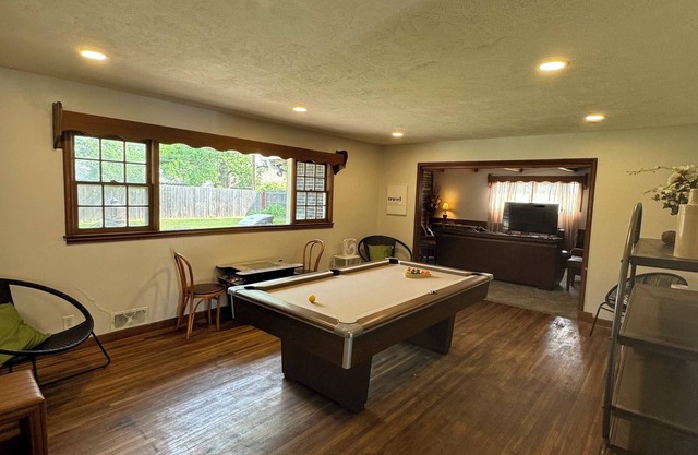 Experience Wichita living near WSU! Fire Pit, Pool Table, and Arcade games.