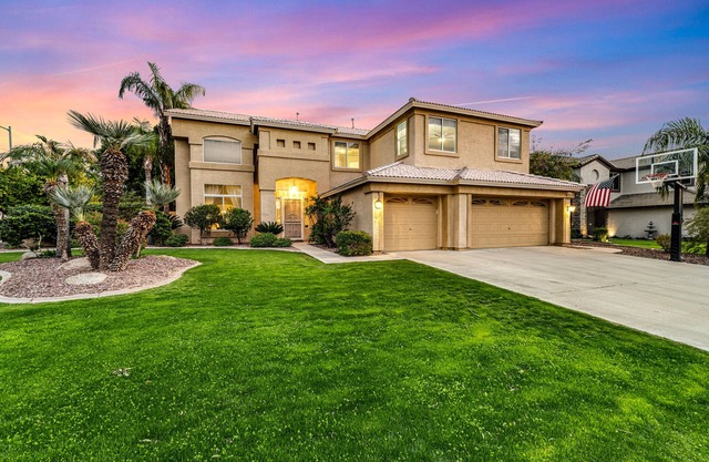 Exquisite home with firepit, game room, heated pool, pool spa, & putting green