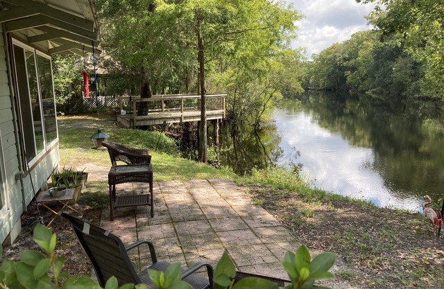 Fish or relax by the river inside or outside at pet-friendly Riverbend Fish Camp