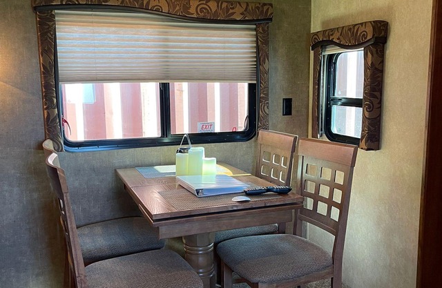Flex RV Travel trailer parked on a beautiful 4 acre lot, overseeing forest land.