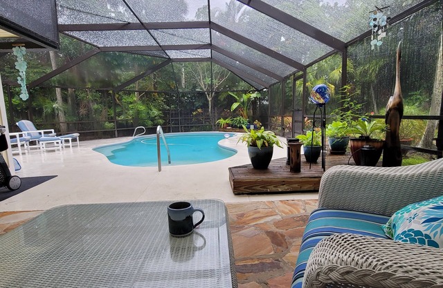Floridian home w/pool & short walk to private beach & river park for kayaking.