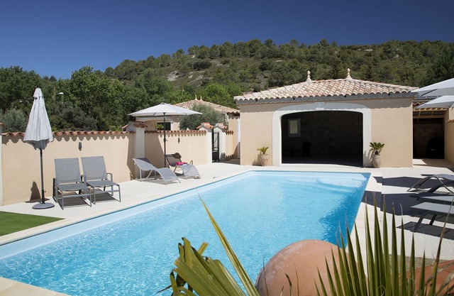 Fully air conditioned with private parking and large shared pool.