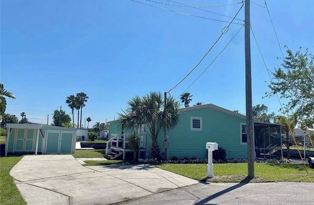 Fully remodeled, adorable coastal canal house on a spacious corner lot.