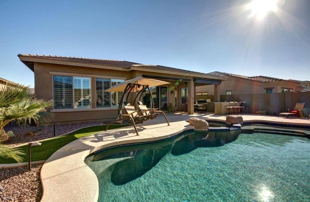 Gated Golf Course community with beautiful backyard oasis!