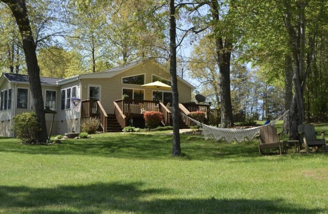 GO JUMP IN THE LAKE at this lovely waterfront home!